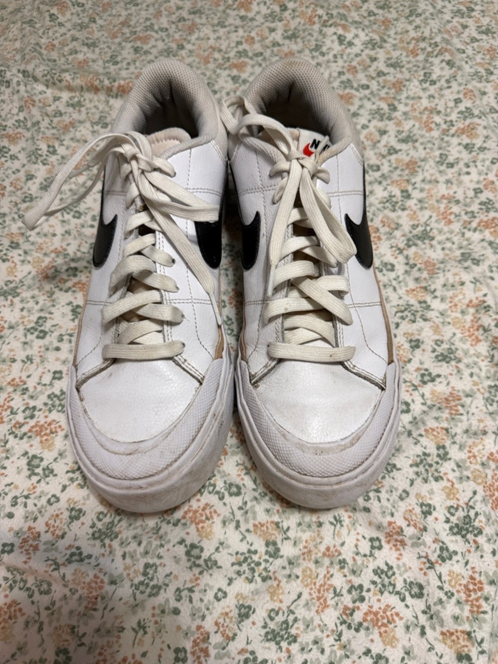Nike White Low-Top Sneakers with Black Swoosh